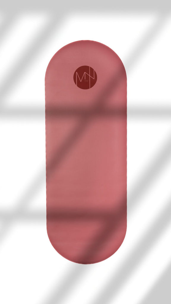 oval pink yoga mat with amzline logo on a white background