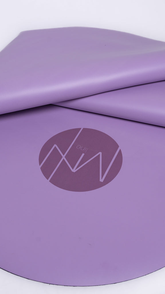 Purple exercise mat with a logo on a white background